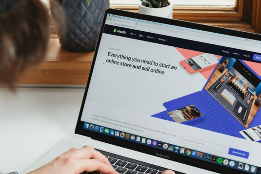 person-using-macbook-pro-on-white-table.jpg person using macbook pro on white table